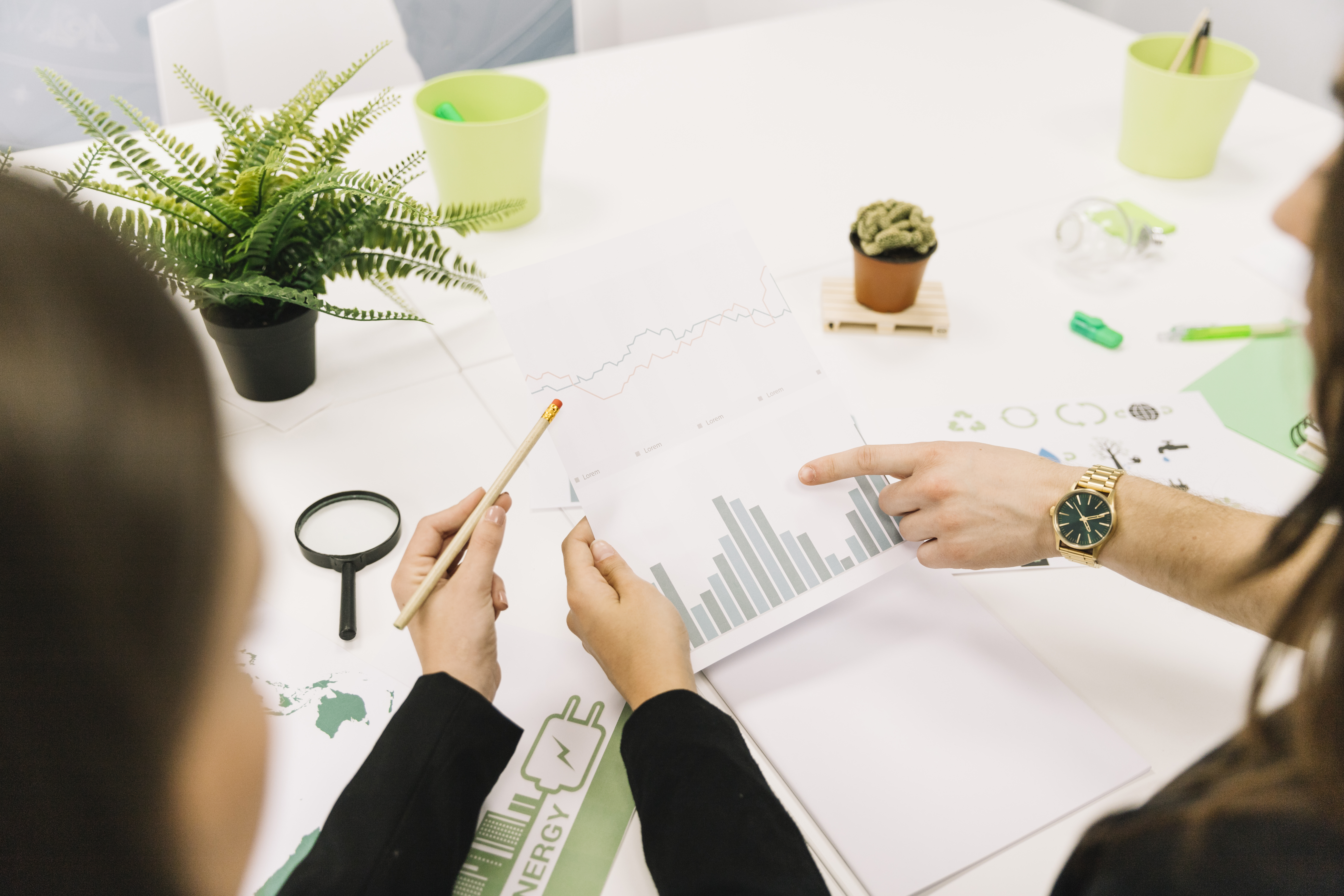 group-of-businesspeople-analyzing-graph-in-office